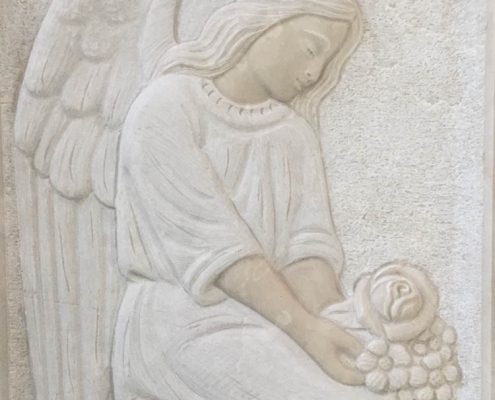 Low relief angel kneeling
